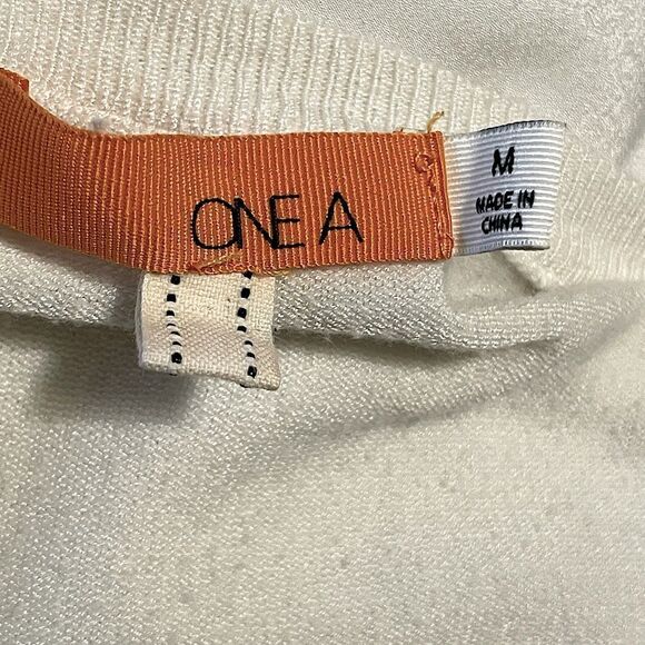 One A White Long Sleeve Top with Elongated Satin-like  Back. Size Medium. - Picture 4 of 4